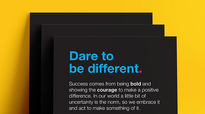 One of Jade's values, Dare to be different, displayed on black card with a explaination of what the value means 